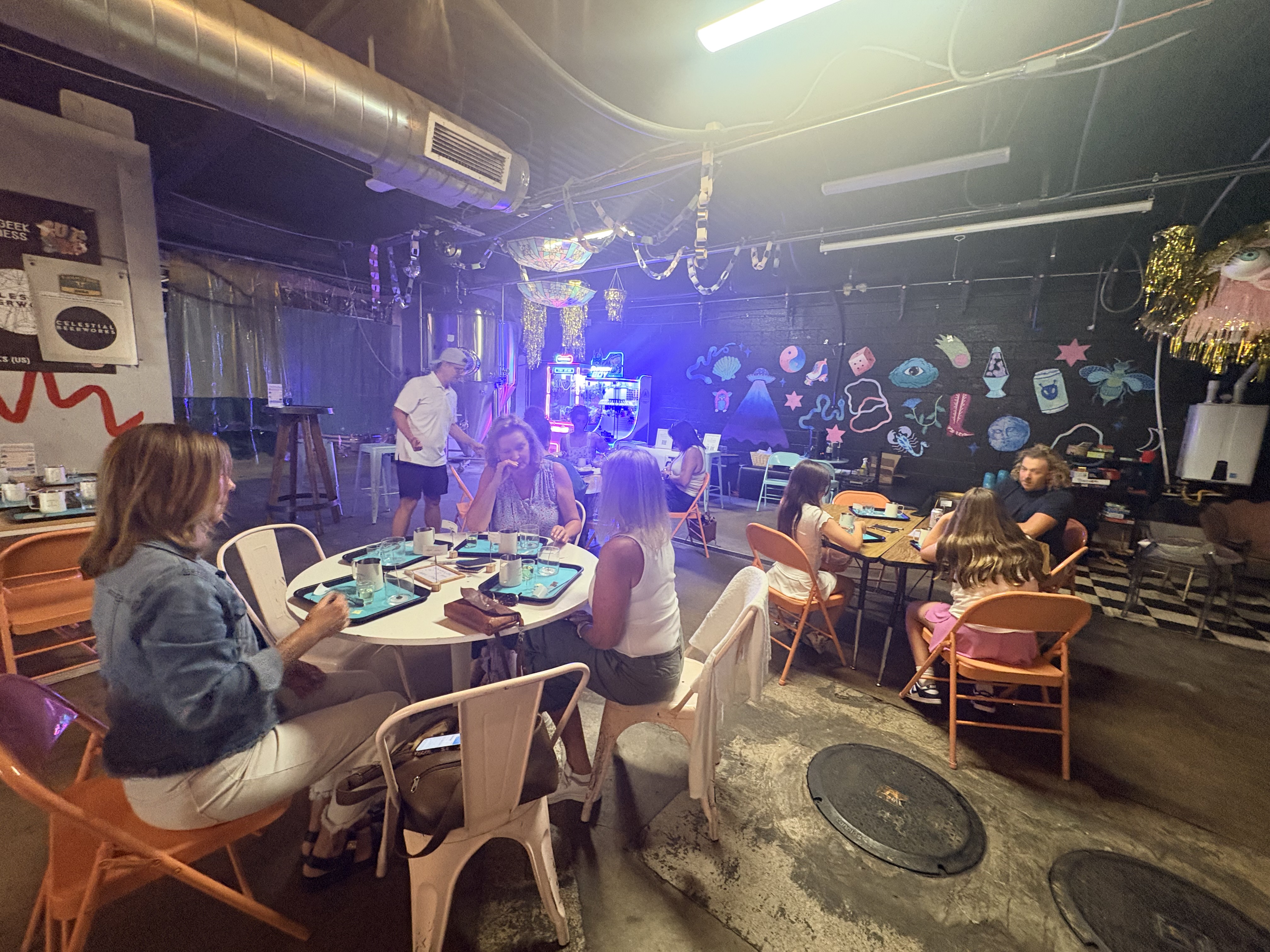 Guests gathered at a public candle-making class at Celestial Beerworks
