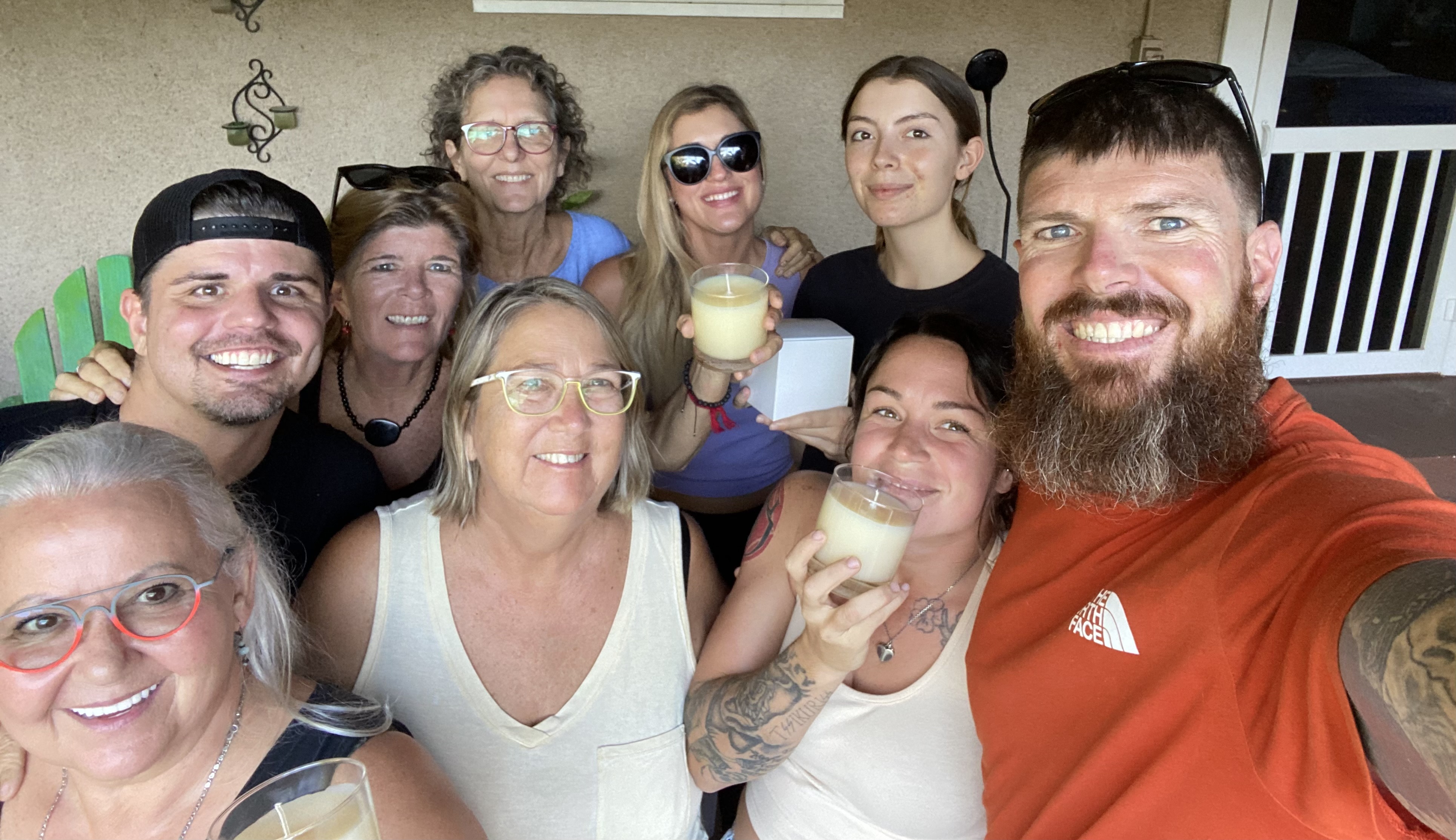 Community Candle Co. guests smiling with finished candles