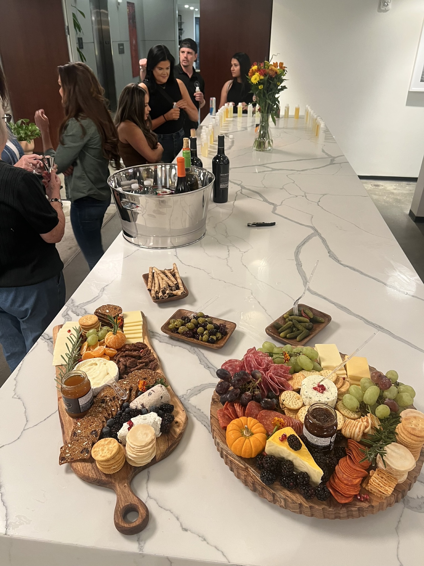 A charcuterie board prepared for a candle-making gathering