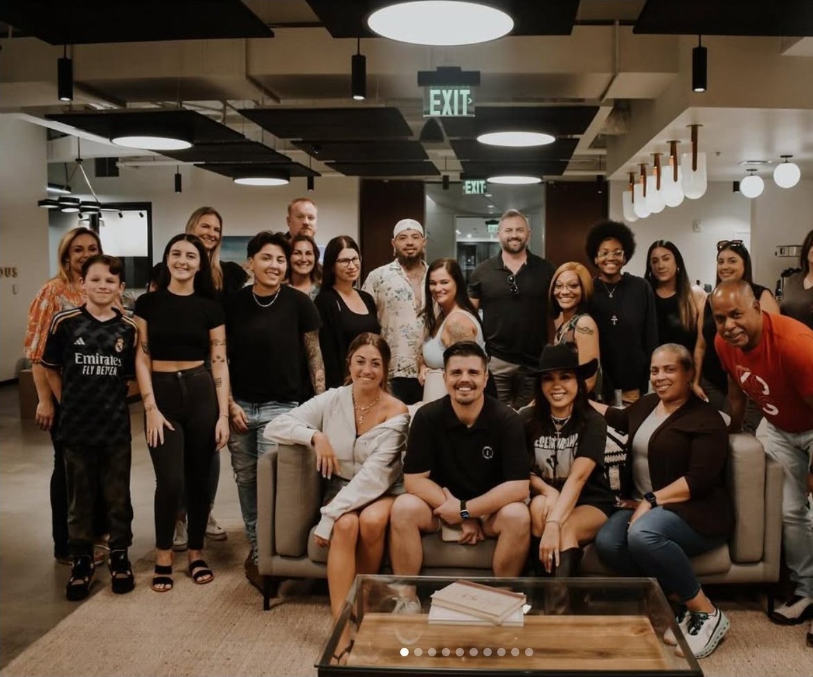 A large group gathered after a Community Candle Co. venue pop-up event