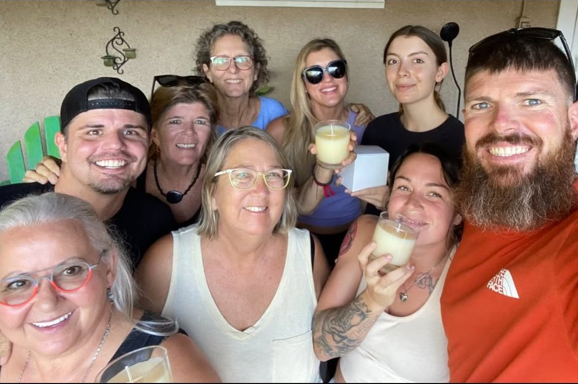 Guests holding finished candles after a candle-making date night