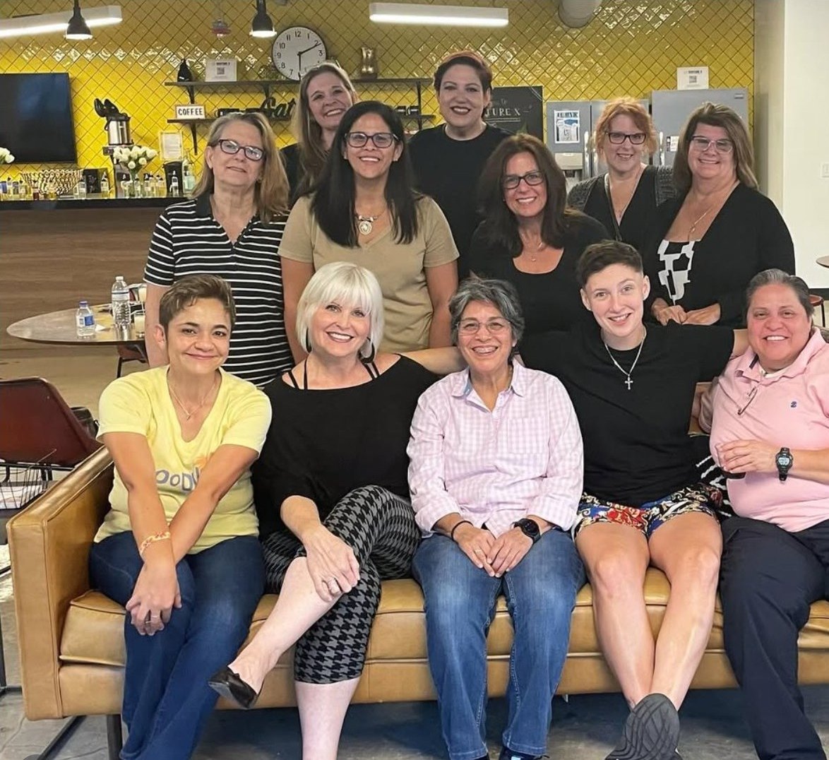 A Community Candle Co. group gathered at a partner venue after class