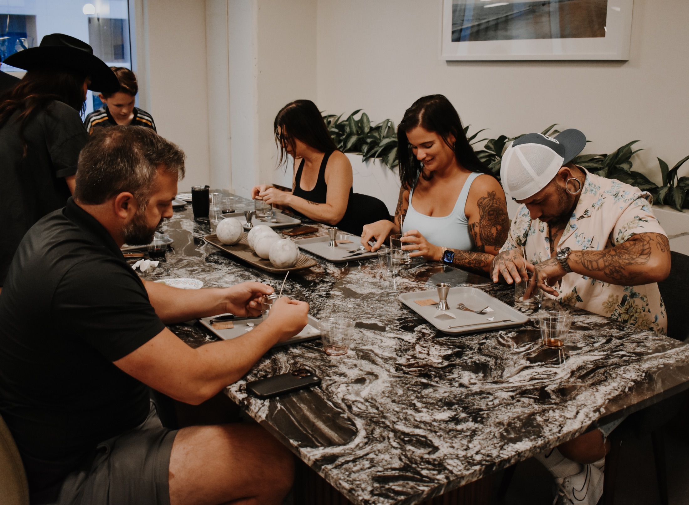 Guests pouring candles during a hands-on class